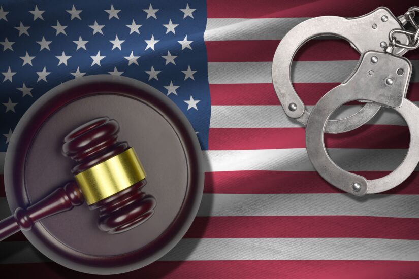 USA Flag With Judges Hammer And Handcuff