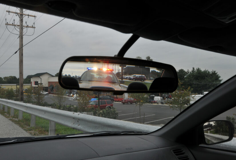 Photo of Police Car on Rear-view Mirror