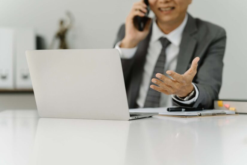 Lawyer on a phone call in his office Lawyer on a phone call in his office