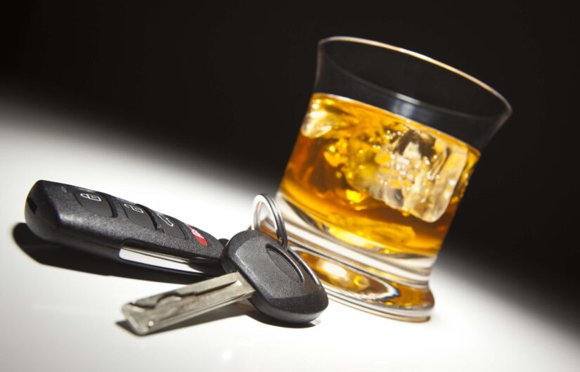 Alcoholic beverages and truck keys in sunlight. Alcoholic beverages and truck keys in sunlight.