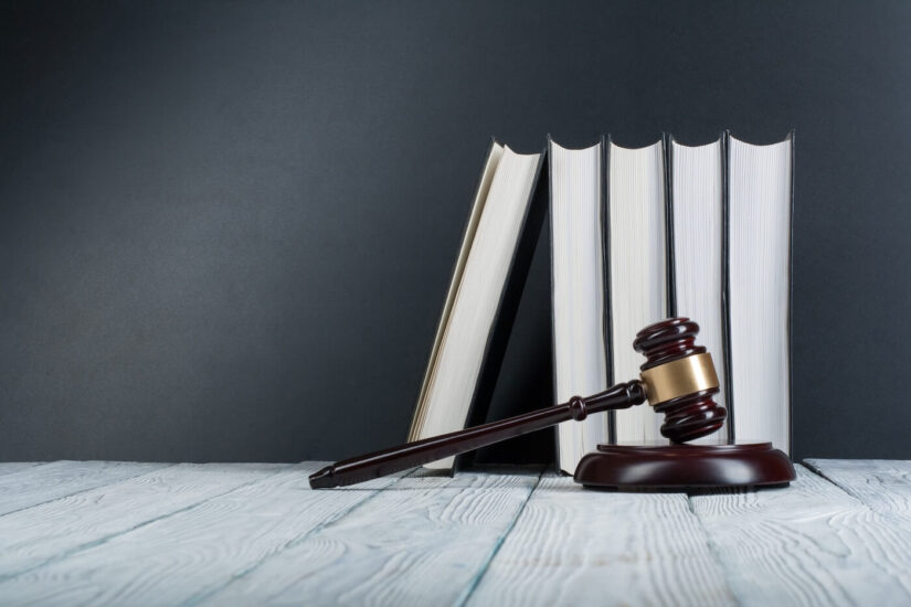 Law book with wooden judge
