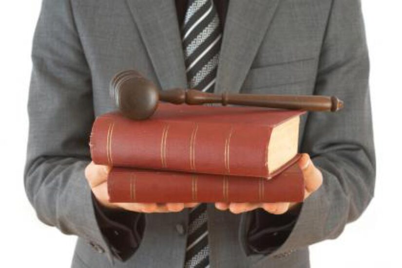 Person holding law books