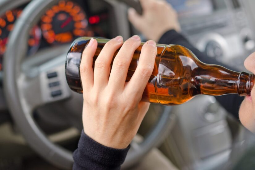 Driver drinking alcohol while driving