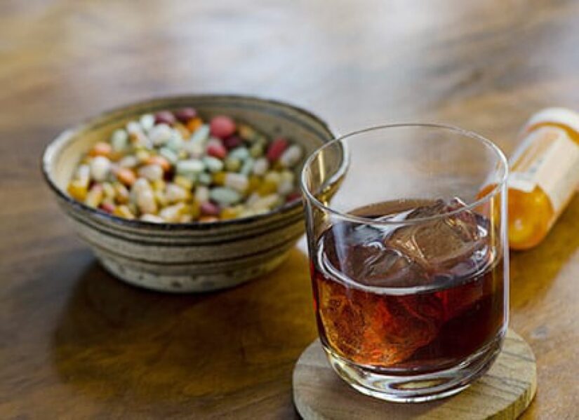 Glass of alcohol on the table